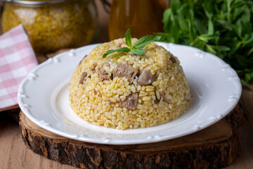 From traditional delicious Turkish cuisine; Bulgur pilaf with meat (Turkish name; etli bulgur pilavi)