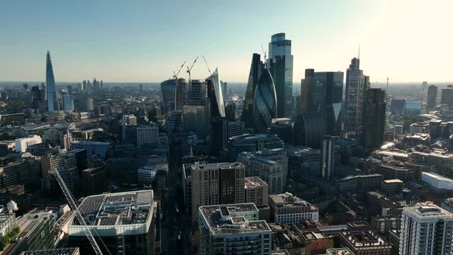 LONDON, UK - 10 JUNE 2022: Establishing Aerial drone View of Gherkin skyscraper with London Skyline, 20 Fenchurch or Walkie Talkie, sky garden by the Thames River, United Kingdom, Europe