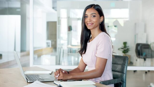 Confident, smiling and trendy businesswoman, marketing intern or social media assistant working, writing and typing on laptop in office. Face portrait of a happy, young and ambitious corporate woman