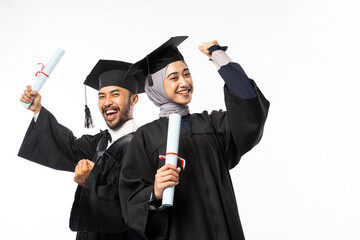 Excited asian female and male graduate students carrying certificate on isolated background