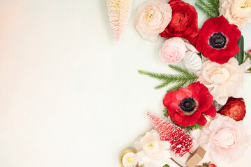 Fototapeta na wymiar Floral Christmas Flat lay with fresh red anemone flowers and copy space
