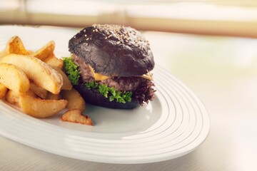 Tasty fresh fast food with French Fries on a plate