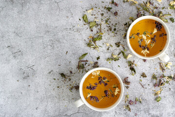 Herbal tea with two white tea cups. Flat lay, top view. Tea concept