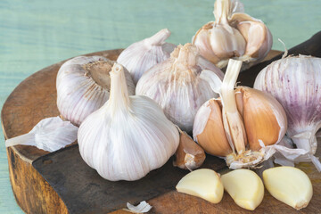 Garlic bulbs on cutting board.