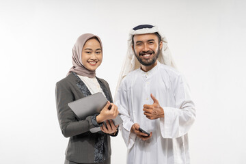 portrait of muslim business partner portrait looking at camera and thumb up