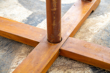 Brown wooden cross on a table