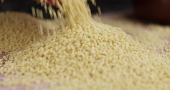 Sprinkle porridge couscous from wheat or millet, cooking dishes from traditional grits of crushed yellow couscous