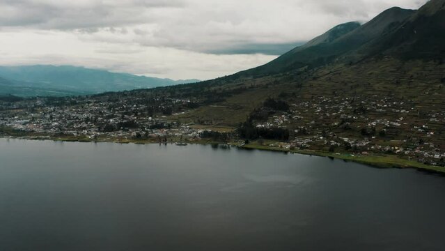 San Pablo Lagoon At The Foot Of Imbabura Volcano In Otavalo, Ecuador With Overcast. tilt-up