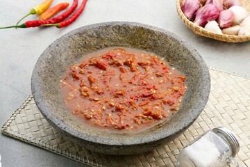 Sambel or Sambal Terasi is traditional food which is popular in Indonesia. Made from tomatoes, chilies, salt, sugar, garlic, shallots and shrimp paste (terasi).
