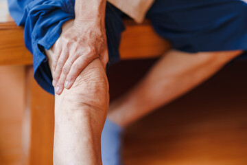 Elderly women have knee pain due to osteoarthritis. Concept of health problems in the elderly.