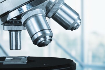 scientist prepare blood sample for research on microscope. Microscope slide. Science and medicine concept.