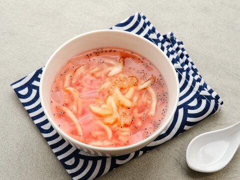 Es Blewah, contain slices of cantaloupe with syrup, basil seed and ice. Popular during Ramadhan in Indonesia. 
