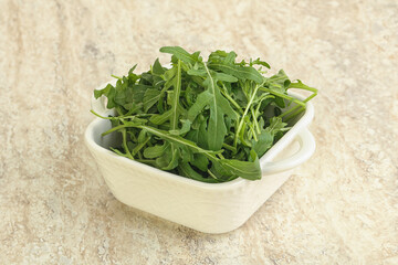 Fresh green arugula in the bowl