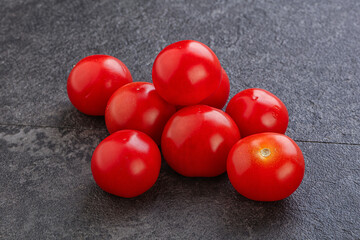 Ripe juicy cherry tomatoes heap