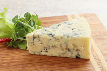 Blue cheese piece over board
