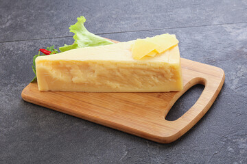 Parmesan cheese piece over board