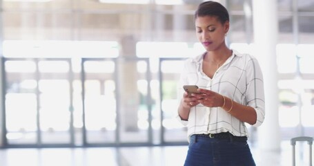 Thinking business woman looking away with ambition, ideas and vision while typing on her phone, planning and brainstorming. Young professional female replying to a message about strategy at work