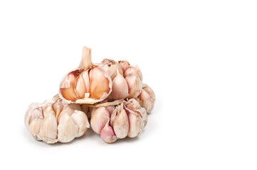 Several large heads of garlic, shot against a white background.