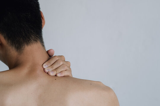 Office syndrome Concept. Young man suffering from neck pain. Headache pain. Health concept..