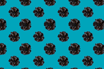 Seamless pattern of pine cones on a blue background. Christmas and New Year.