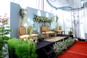 Wedding decorations. Wedding backdrop with flowers and Indonesian wedding decorations.