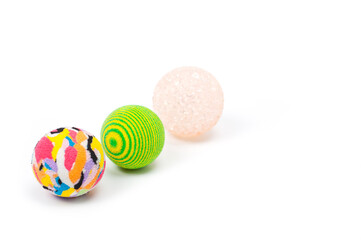 Several plastic and rubber balls for playing with pets.
