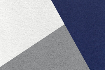 Texture of craft navy blue, white and gray shade color paper background, macro. Structure of vintage abstract indigo cardboard with geometric shape and gradient. Felt backdrop closeup. - obrazy, fototapety, plakaty