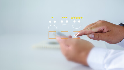 Obraz premium Businessman score 5 virtual stars Satisfaction Assessment Survey Experience feedback business quality, service, service compliments. Best. Five-star rating. service rating Satisfaction Concept.