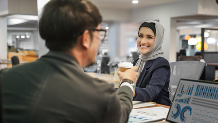 Fototapeta premium business coffee work 2 young woman and man hot drink coffee meeting in cafe communication Business People Chatting Girl using smartphone, blogging. Teamwork, business meeting working