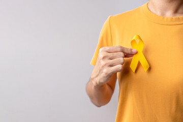 Yellow September, Suicide prevention day, Childhood, Sarcoma, bone and bladder cancer Awareness month, Yellow Ribbon for supporting people life and illness. Healthcare and World cancer day concept - obrazy, fototapety, plakaty