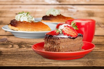 Composition with assorted cakes. Set of dessert. Pieces of cakes