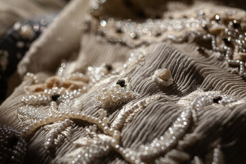 close-up handmade vintage embroidery with beads. selective focus.