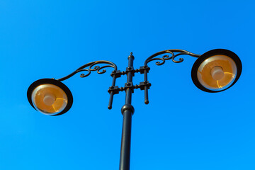 Street light against sky . City lamps at blue background
