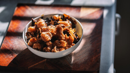 Honey chicken and rice beautifully presented in a bowl.