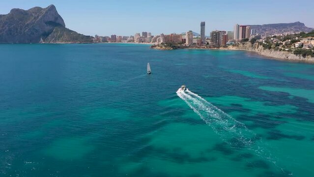 Speedboat Leaving Wake In The Blue Sea At Summer In Calpe, 	Alicante, Spain. - aerial