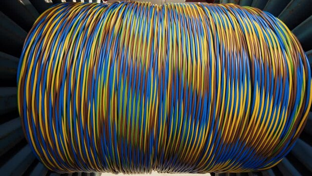Cable factory.Winding of the electrical cable to the bobbin in the production. Cable pdroduction. Close up.4K