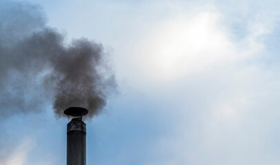 thick dark smoke from the chimney