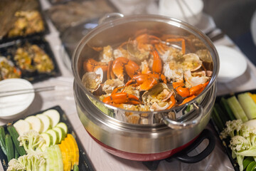 Steamed seafood in the pot at home