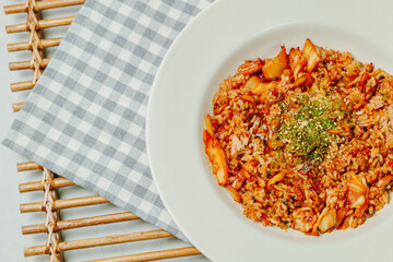 Korean food Kimchi Fried Rice Kimchibokkeumbap, Rice fried with finely chopped kimchi. Beef, pork, onions, green onions, and other vegetables may be added according to taste.