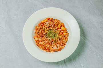 Korean food Kimchi Fried Rice Kimchibokkeumbap, Rice fried with finely chopped kimchi. Beef, pork, onions, green onions, and other vegetables may be added according to taste.