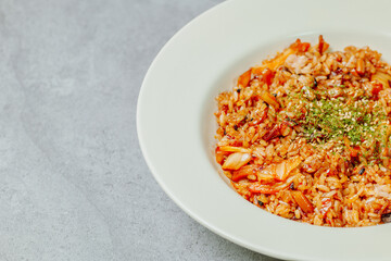Korean food Kimchi Fried Rice Kimchibokkeumbap, Rice fried with finely chopped kimchi. Beef, pork, onions, green onions, and other vegetables may be added according to taste.