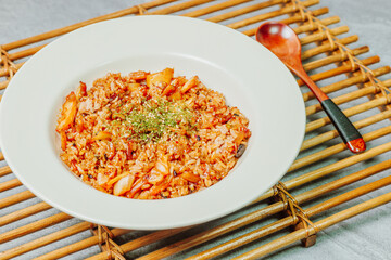 Korean food Kimchi Fried Rice Kimchibokkeumbap, Rice fried with finely chopped kimchi. Beef, pork, onions, green onions, and other vegetables may be added according to taste.