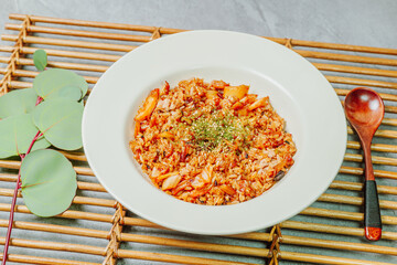 Korean food Kimchi Fried Rice Kimchibokkeumbap, Rice fried with finely chopped kimchi. Beef, pork, onions, green onions, and other vegetables may be added according to taste.