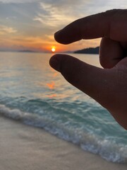 sunset hand
