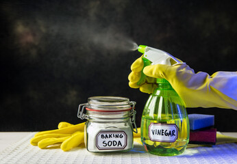 Using baking soda Sodium bicarbonate and white vinegar for home cleaning. White vinegar in spray...