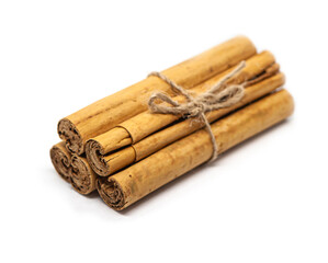 Ceylon cinnamon sticks on white background. H1 Sri Lankan authentic cinnamon. True cinnamon sticks. Pure Ceylon cinnamon. Close up.