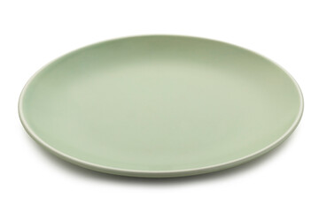 Empty flat grayish green plate for placing any foods, isolated on white background with clipping path. The image was shot at a 30-degree hero angle.