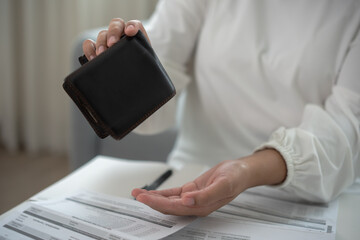 Worried unemployment woman open empty wallet on payday