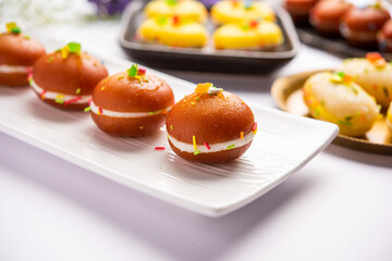 Malai Chop or Cream sandwich made using filling Rasgulla or Gulab jamun sweet is a Bengali sweet