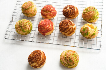 Choux pastry contains butter, water, flour, and eggs. Choux pastries are sometimes filled with...